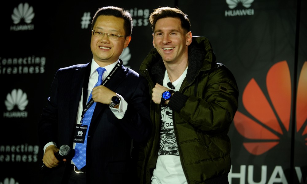 Lionel Messi right shows off his new Huawei watch presented to him by Tyrone Liu CEO Consumer Business Group for Huawei Latin America