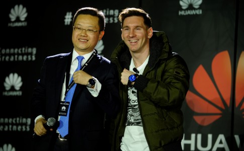 Lionel Messi right shows off his new Huawei watch presented to him by Tyrone Liu CEO Consumer Business Group for Huawei Latin America