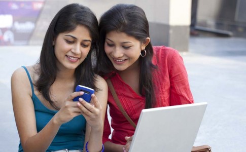 college students using mobile stock image