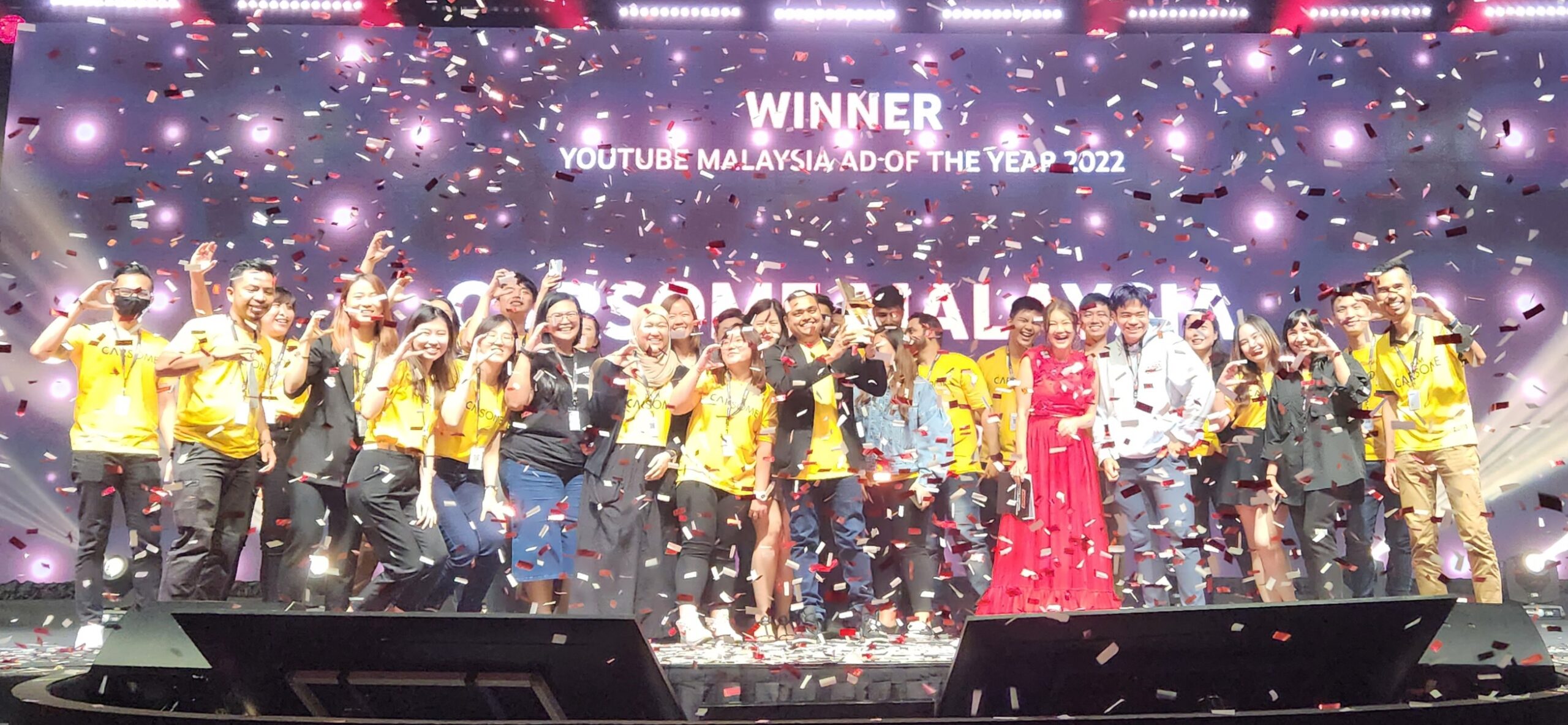 Ad of the Year Winner CARSOME with award presenters and creators Haze Leong in red and Banden in white scaled