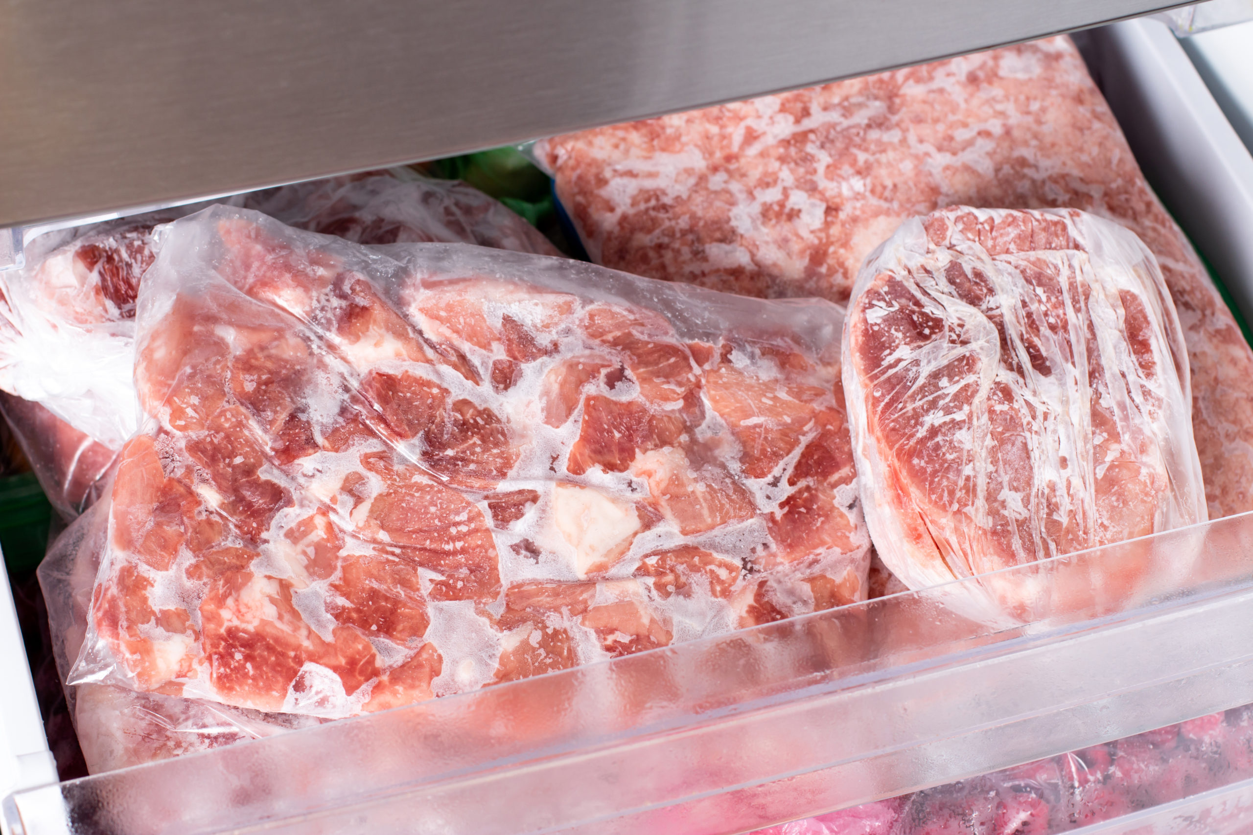 frozen pork meat which has been vacuum sealed inside fridge freezer frozen food scaled 1