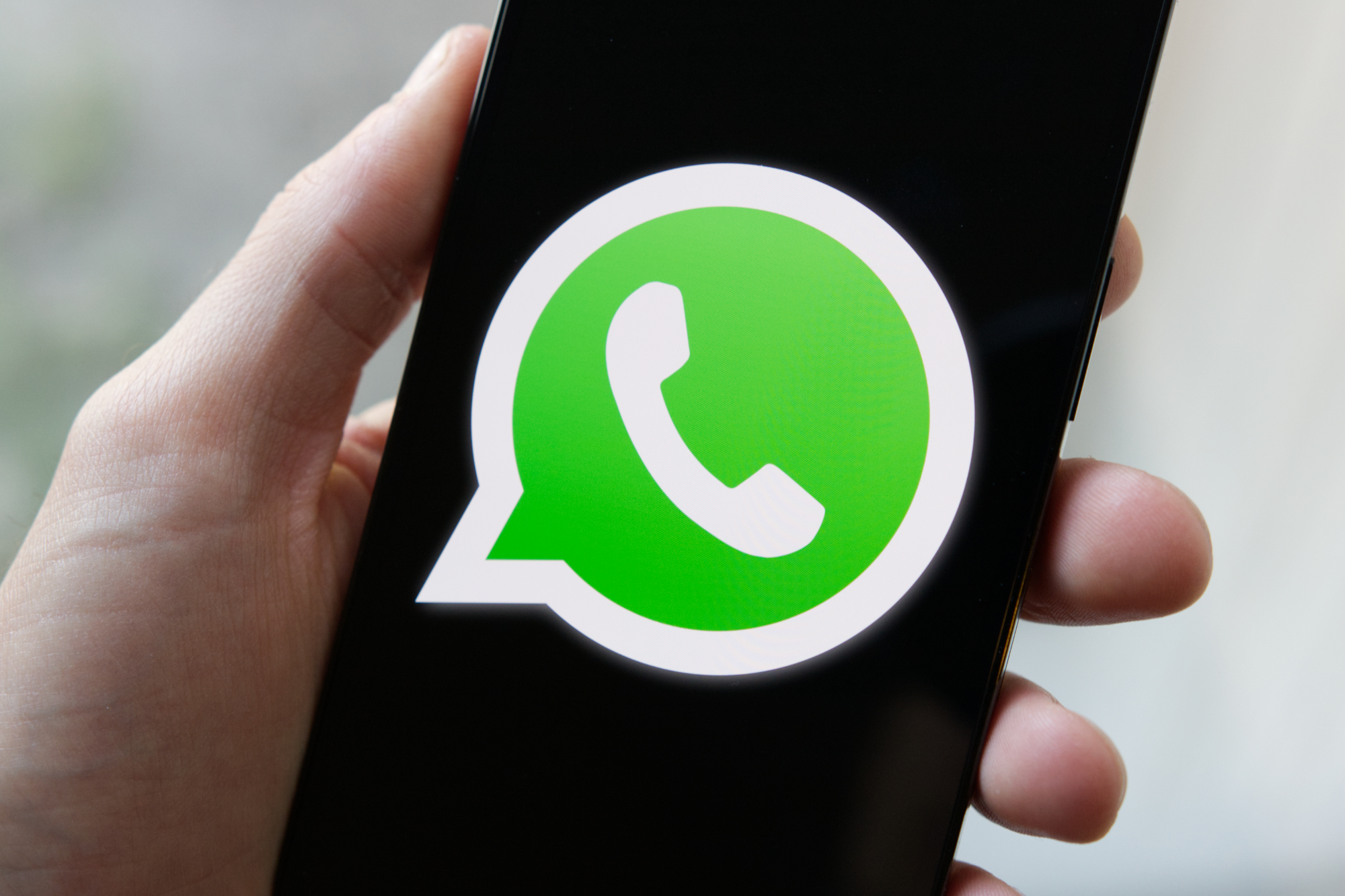 whatsapp logo phone close